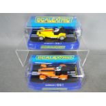 Scalextric - 2 x Caterham 7 limited edition slot cars.