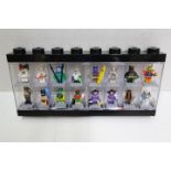 LEGO - A black plastic Lego display case in black containing 16 Lego 'Batman' themed minifigures.