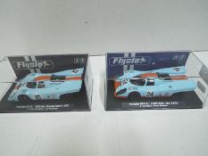 Flyslot - 2 x Porsche 917K 1070 models in Gulf livery in perspex display cases # 005104, # 706101.
