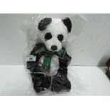Charlie Bears - Panda with a tartan bow. Jointed. Factory sealed with tag inside. 33cm high.
