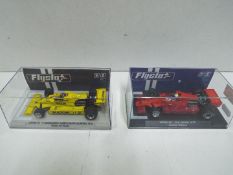 Flyslot - 2 x Lotus 78 slot car models # 058102, # 058104 in perspex display cases.