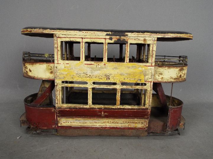 A scratch built wooden model of a double deck Liverpool Corporation Tramcar.
