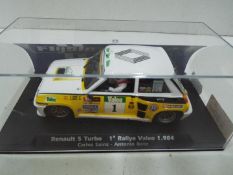 Flyslot - Renault 5 Turbo Carlos Sainz Rally Valeo 1984 in a perspex display case. # 037101.