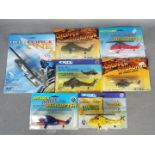 Ertl - Seven boxed / carded diecast model helicopters by Ertl.