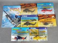 Ertl - Seven boxed / carded diecast model helicopters by Ertl.