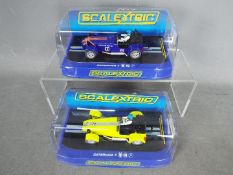 Scalextric - 2 x Caterham 7 limited edition slot cars,