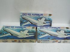 Revell - Three boxed Revell H-119 1:144 scale DC10 Airbus plastic model kits.