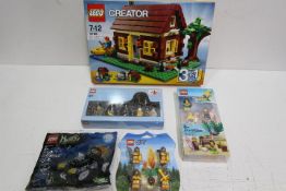 LEGO - A boxed Lego Creator set with 4 sets of Minifigures.