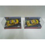 SCX - 2 x Audi TT-R Hockenheim 2001 slot car models in perspex display cases.