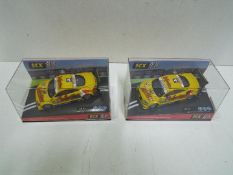 SCX - 2 x Audi TT-R Hockenheim 2001 slot car models in perspex display cases.