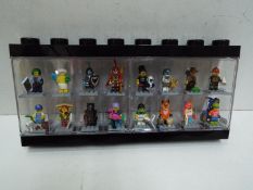 LEGO - A black plastic Lego display case in black containing 16 Lego minifigures.