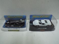 Scalextric - Ford GT40 # C2473 in plain white finish and Ford GT GTE Heritage Edition # C4063 in
