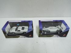 Scalextric - 2 x limited edition Club Ascari cars in plain white finish.