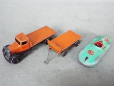 Dinky Toys - An unboxed Dinky Toys 25c Flat Truck in orange with type 4 detailed moulded chassis,