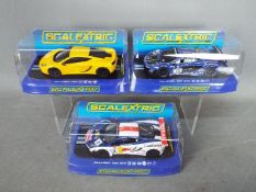 Scalextric - 3 x McLaren 12 C slot cars # C3278 in yellow, # C3505 Gemballa Racing in blue,