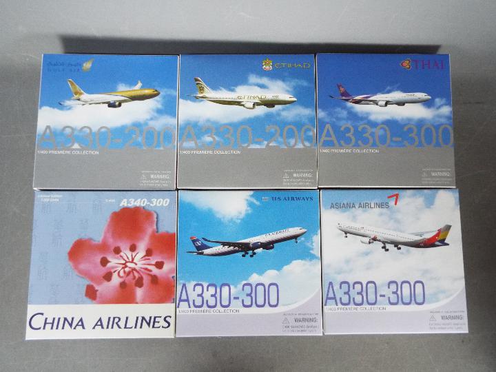 Dragon Wings - A group of six boxed diecast 1:400 scale model aircraft in various carrier liveries
