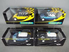 Scalextric - 4 x Mini slot cars including 2 x Cooper and 2 x Cooper S models.