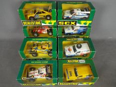 Scalextric - SCX - 8 x Rally vehicles including 3 x Nissan Patrol, 2 x Peugeot 405,