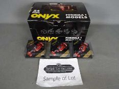 Onyx - A trade box of 24 diecast 1:43 scale diecast F1 racing cars.