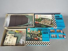 Herpa - Four boxed slot car trackside building kits and accessories from Herpa.