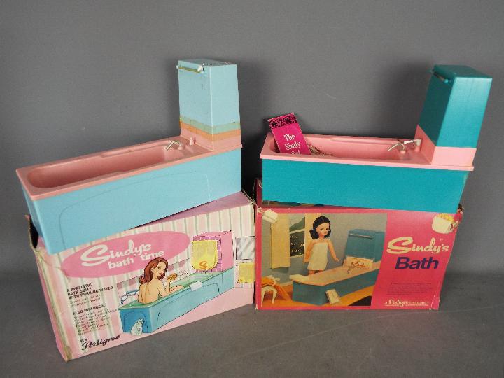 A boxed 1960's bathtime and boxed 1960's blue & pink bath Lot descriptions reflect the