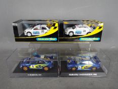 Scalextric - 4 x cars, 2 x Subaru Impreza and 2 x Mitsubishi Evo models.