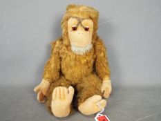 Herman Joko - A vintage Herman Jocko Monkey with mohair body, felt face, ears, hands and feet,