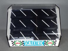 Scalextric - A vintage Scalextric perspex Shop Display Cabinet.