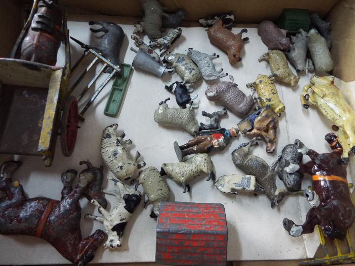 Britains, Unknown Makers - A large unboxed collection of vintage metal civilian figures and animals, - Image 4 of 4