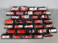 Del Prado - A brigade of over 30 unboxed Del Prado diecast Fire Appliances.