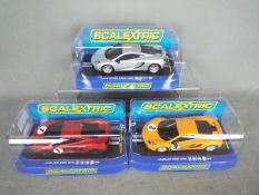 Scalextric - three 1:32 scale Scalextric cars comprising two Jaguar XKR GT3 and a McLaren MP4-12C