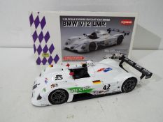 Kyosho - A BMW V12 LMR in 1:18 scale in 1999 Sebring winning livery # 42.