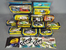 Corgi - A lot of 12 boxed emergency vehicles in 1:43 scale and 5 x catalogues.