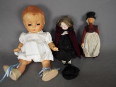 A collection of three unboxed vintage dolls.