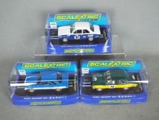 Scalextric - Three boxed Scalextric Ford Escort Mk.1 slot cars.