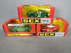 Scalextric - SCX - 3 x Porsche slot cars including 911 # 83590, 959 # 83660, 953 # 8335.