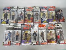 McFarlane Toys - A crawl of 15 boxed 'The Walking Dead' action figures from McFarlane Toys.