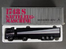 NZG - A boxed 1:43 scale diecast #313 Mercedes-Benz 1748S Container Truck.