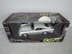 Autoart - James Bond Goldfinger Aston Martin DB5 in 1:18 scale, the car appears in Mint condition,