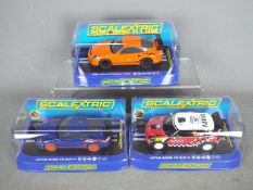 Scalextric - Three boxed Scalextric slot cars in unassociated boxes.