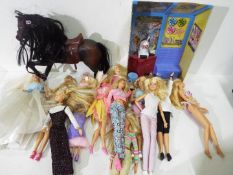 Mattell - Barbie - A gaggle of 10 x Barbie dolls, a horse and various accessories.
