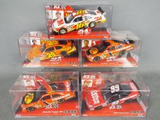 SCX - A grid of 5 x Nascar models including 2 x Ford Fusion and 3 x Chevrolet Impala SS cars in