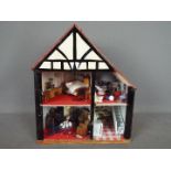 A scratch built wooden two storey dolls house.