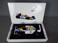 Spark - A 1:18 scale 1987 Williams FW 11B number 6 Formula 1 car as driven by Nelson Piquet in the