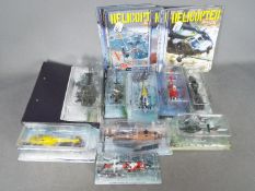 Amer Collection - A group of 9 x carded military helicopter models with a binder and associated