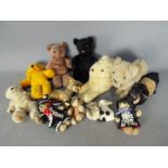 Unconfirmed Makers - A menagerie of 13 vintage and modern teddy bears and soft animal toys.