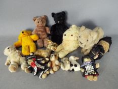 Unconfirmed Makers - A menagerie of 13 vintage and modern teddy bears and soft animal toys.