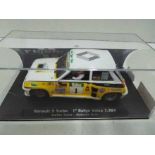 Flyslot - Renault 5 Turbo Carlos Sainz Rally Valeo 1984 in a perspex display case. # 037101.