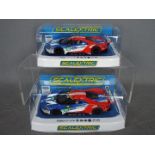 Scalextric - 2 x Ford GT GTE Le Mans cars in matching livery with consecutive numbers.