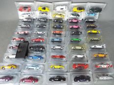 DeAgostini - A collection of 50 x carded 1:43 Porsche Collection models including 911 Turbo slant